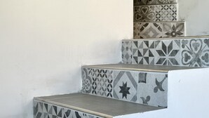 A staircase with patterned tiles. - SE104 - Senigallia, elegant four-room apartment convenient to services (Senigallia)