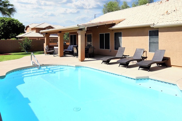 Backyard Pool: Refreshing pool with floats, toys & basketball hoop fun