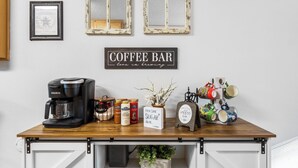 A coffee bar setup with a coffee maker, mugs, and a sign that reads "COFFEE BAR". - Randy's Place - Beautiful 4br W/Private Hot tub! (Bandera)