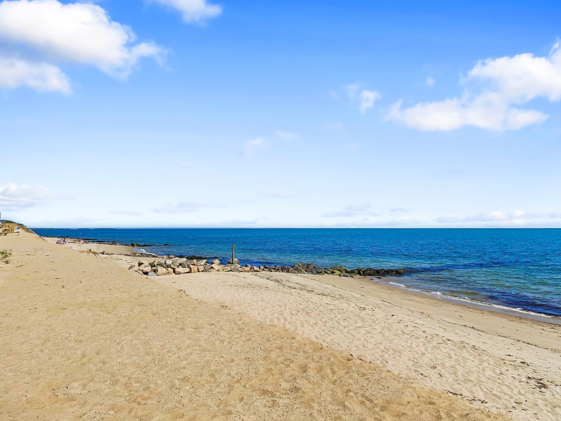 A beach with clear skies and calm waters.