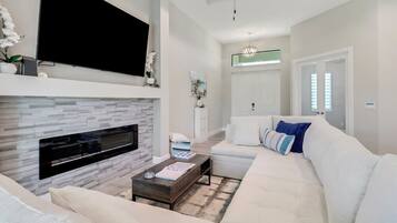 Smart TV, fireplace, books, music library