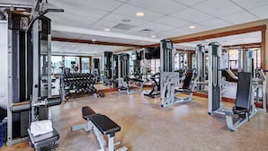 A gym with various exercise equipment, including dumbbells, benches, and weight machines. - Fantastic 3 Bedroom 2 Bath Ski In Ski Out, (Breckenridge)