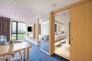 Junior Suite, 1 King Bed, Lake View | Living area | 43-inch LED TV with cable channels