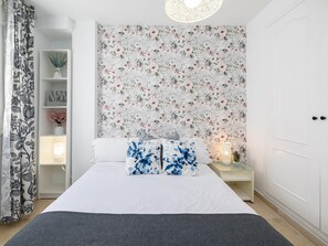 1 bedroom, desk, iron/ironing board, travel crib