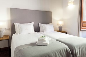 Iron/ironing board, travel crib, free WiFi, bed sheets