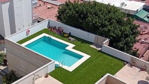 A rooftop pool with a clear blue water feature, surrounded by a well-maintained green lawn and potted plants. - Marysol 32 - Penthouse in Benalmádena with swimming pool, 2 terraces, garage (Benalmádena)