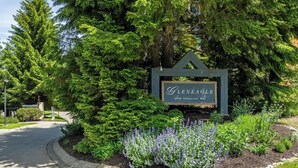 A sign for 'Genealle' with a blackcomb way address. - Golf course townhouse w/ free shuttle, parking (Whistler)