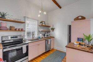 Fridge, stovetop, dishwasher, coffee/tea maker