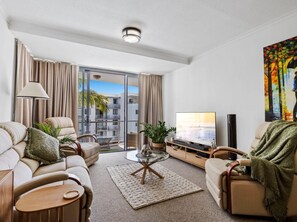 Deluxe Apartment, 2 Bedrooms, Balcony | Living area | 55-cm Smart TV with digital channels, Netflix, streaming services