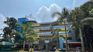 A hotel with a modern design, featuring multiple balconies and a central entrance. - Hotel Meghnath Palace (Jalpaiguri)