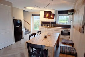 Enjoy cooking in this well-equipped kitchen with a central island and oven.
