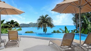 A poolside area with lounge chairs and umbrellas, overlooking a clear blue ocean and palm trees. - The Bay Seychelles Boutique Hotel and Apartments (Mahé Island)