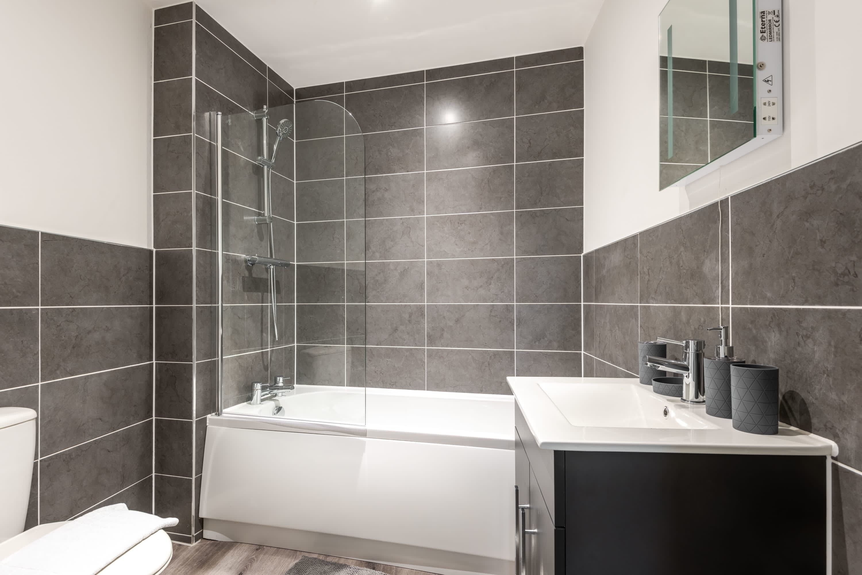 Shower, hair dryer, towels, shampoo