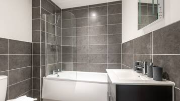 Shower, hair dryer, towels, shampoo