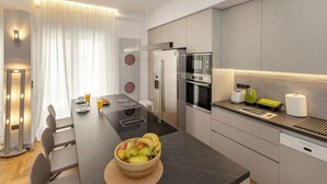 Een moderne keuken met een centraal eiland, roestvrijstalen apparatuur en een eetgedeelte met een tafel en stoelen.