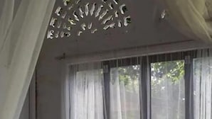 A room with a sofa, a coffee table, and sheer curtains. - Langkawi Rouhi Retreats at Langkawi (Langkawi)