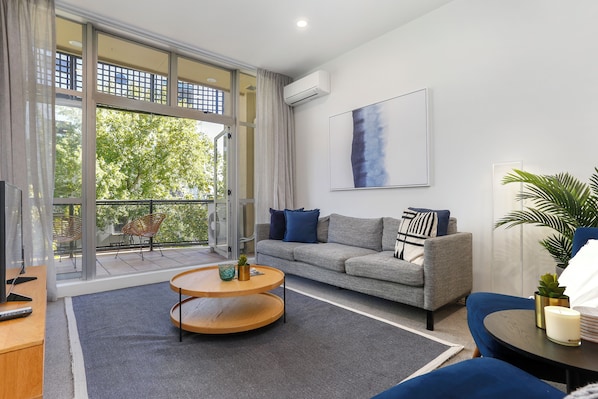 Apartamento, 2 quartos | Área de estar