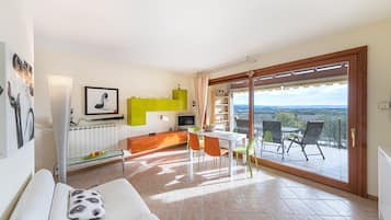 Apartment, Pool View | Living area | 35-inch TV with satellite channels
