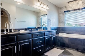 Shower, hair dryer, towels, toilet paper