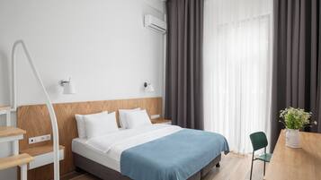 Premium bedding, desk, laptop workspace, iron/ironing board (on request)