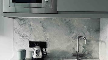 Fridge, microwave, stovetop, coffee/tea maker