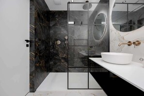 Shower, hair dryer, towels, shampoo