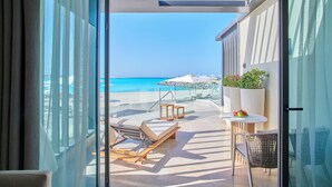 A balcony with a view of the beach, lounge chairs, and umbrellas. - Address  Beach Resort Marassi (El Alamein)