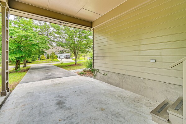 A covered concrete driveway leading to a house with a beige exterior. - < 2 Mi to Golf Course: Pinehurst Home w/ Deck! (Pinehurst)