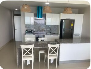 Fridge, microwave, coffee/tea maker, toaster