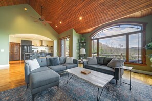 TV, fireplace, books - Pisgah Forest Home w/ Large Deck & Mountain Views! (Pisgah Forest)