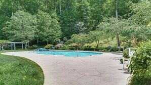 A concrete pool area with a gazebo, surrounded by lush greenery and trees. - Golf Gem in Trillium Links 1 Mi to Cashiers (Cashiers)