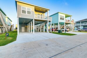 A two-story building with a covered walkway and a balcony. - Bright Rockport Vacation Rental w/ Community Pool! (Rockport)