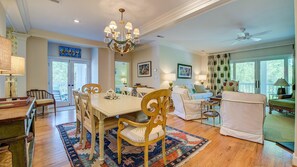 Cozy living area with a large dining table and comfortable seating, perfect for relaxing and socializing.