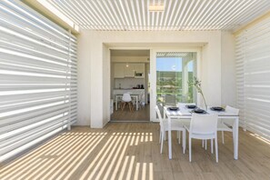 Apartment, 1 Bedroom, Balcony | Dining room - Stunning Capo Falcone Charming Apartments for 4 People B4P Bilo4 Premium (Stintino)