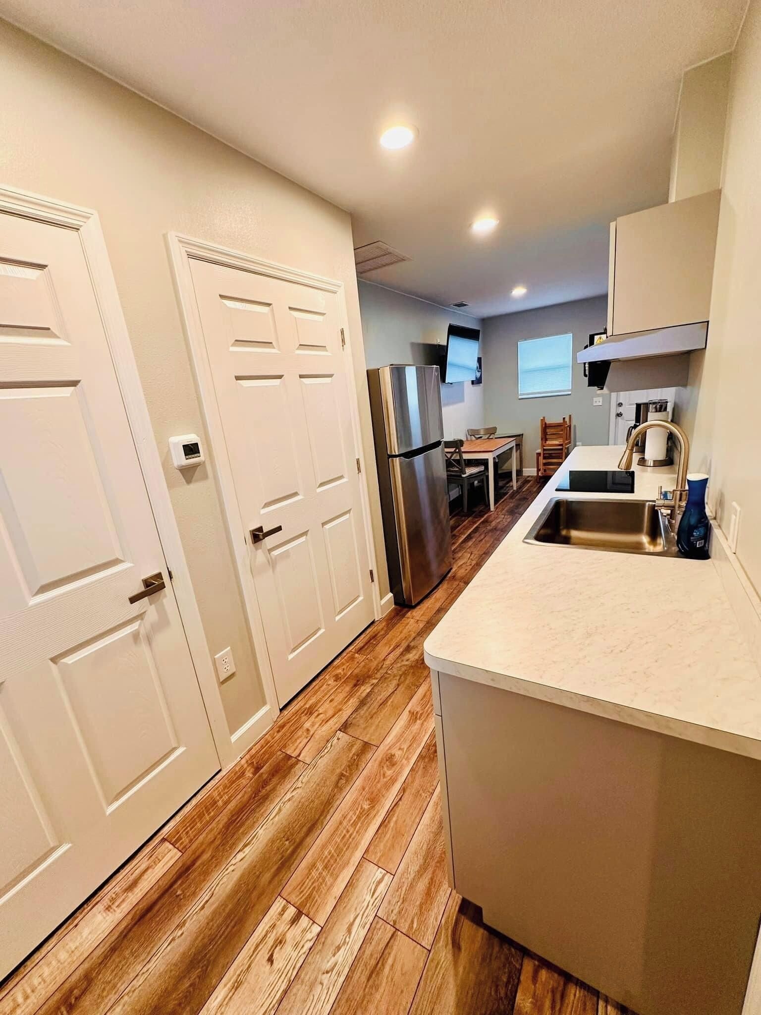 Fridge, microwave, stovetop, coffee/tea maker