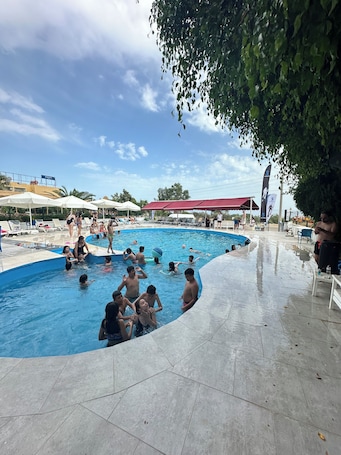 Seasonal outdoor pool, pool umbrellas, sun loungers
