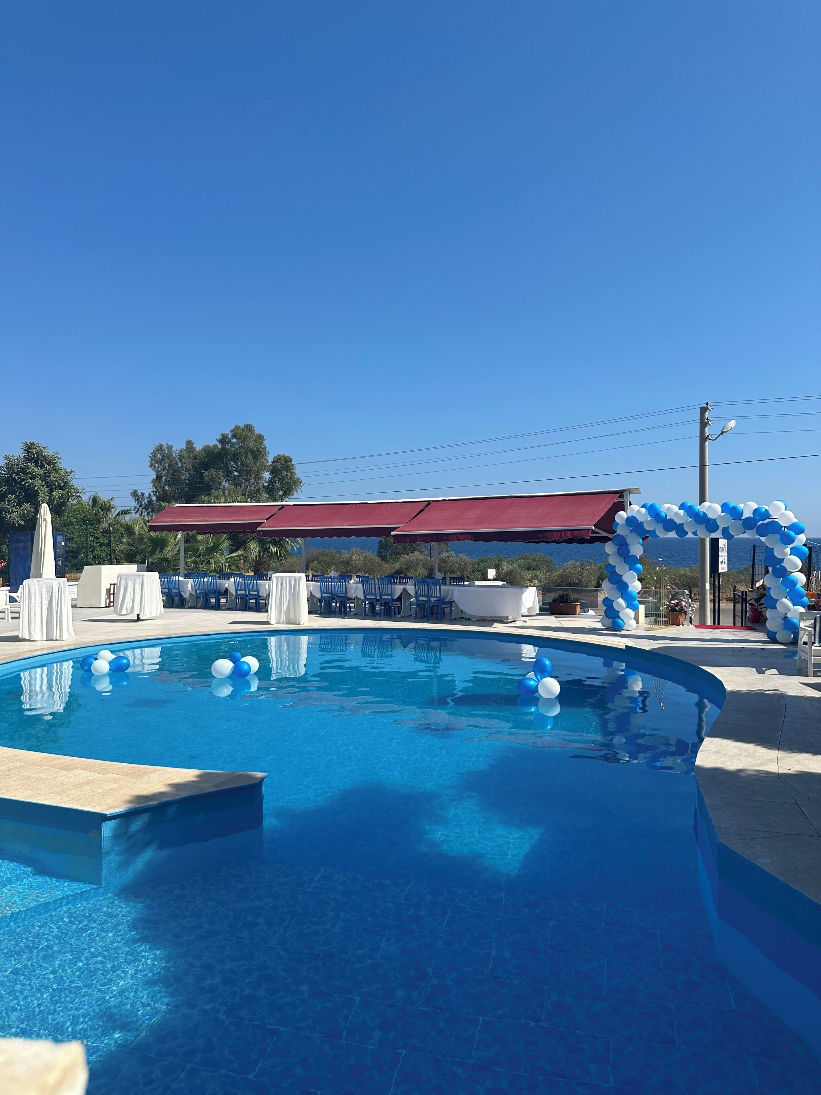 Seasonal outdoor pool, pool umbrellas, pool loungers