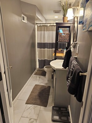 Shower, hair dryer, towels, soap