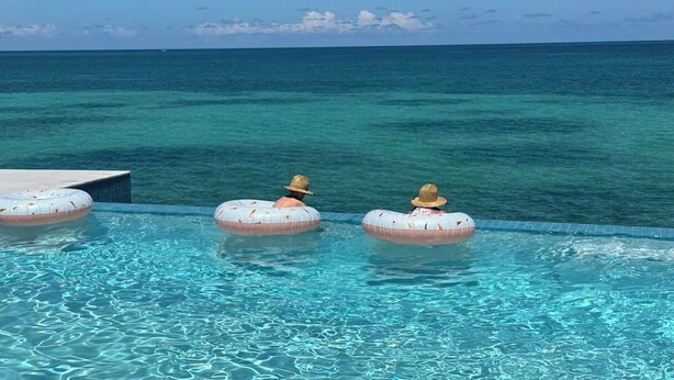 A pool with clear blue water and a view of the ocean. - Sweet Bahama Blue - Spanish Wells, Bahamas (Spanish Wells)