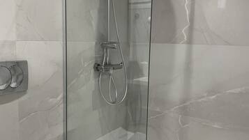 Suite, 2 Bedrooms, Ground Floor | Bathroom | Shower, hair dryer, towels, soap