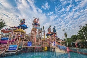 A water park with multiple slides and a pool area. - Xuzhou Amusement Land Resort Hotel (Xuzhou)