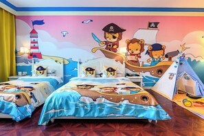 A children's room with two beds, each with a nautical-themed bedspread, a mural of a pirate ship, and a tent on the floor. - Xuzhou Amusement Land Resort Hotel (Xuzhou)
