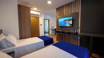 Deluxe Quadruple Room, Pool View | Desk, laptop workspace, free WiFi, bed sheets