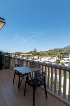 Deluxe Triple Room, Pool View | Terrace/patio