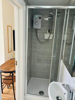 Shower, hair dryer, towels, soap