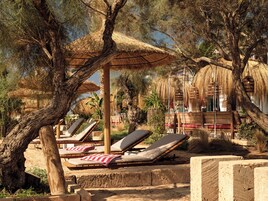 Beach nearby, white sand, beach towels