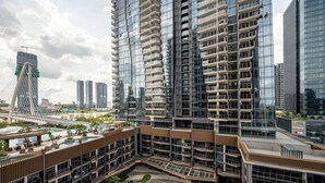 A high-rise residential building with multiple balconies, a rooftop pool, and a modern architectural design. - The Opera Residences (Ho Chi Minh City)