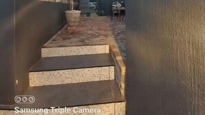 A modern interior with a glass ceiling, a staircase, and a seating area. - A nestled retreat to create memories (Cape Town)