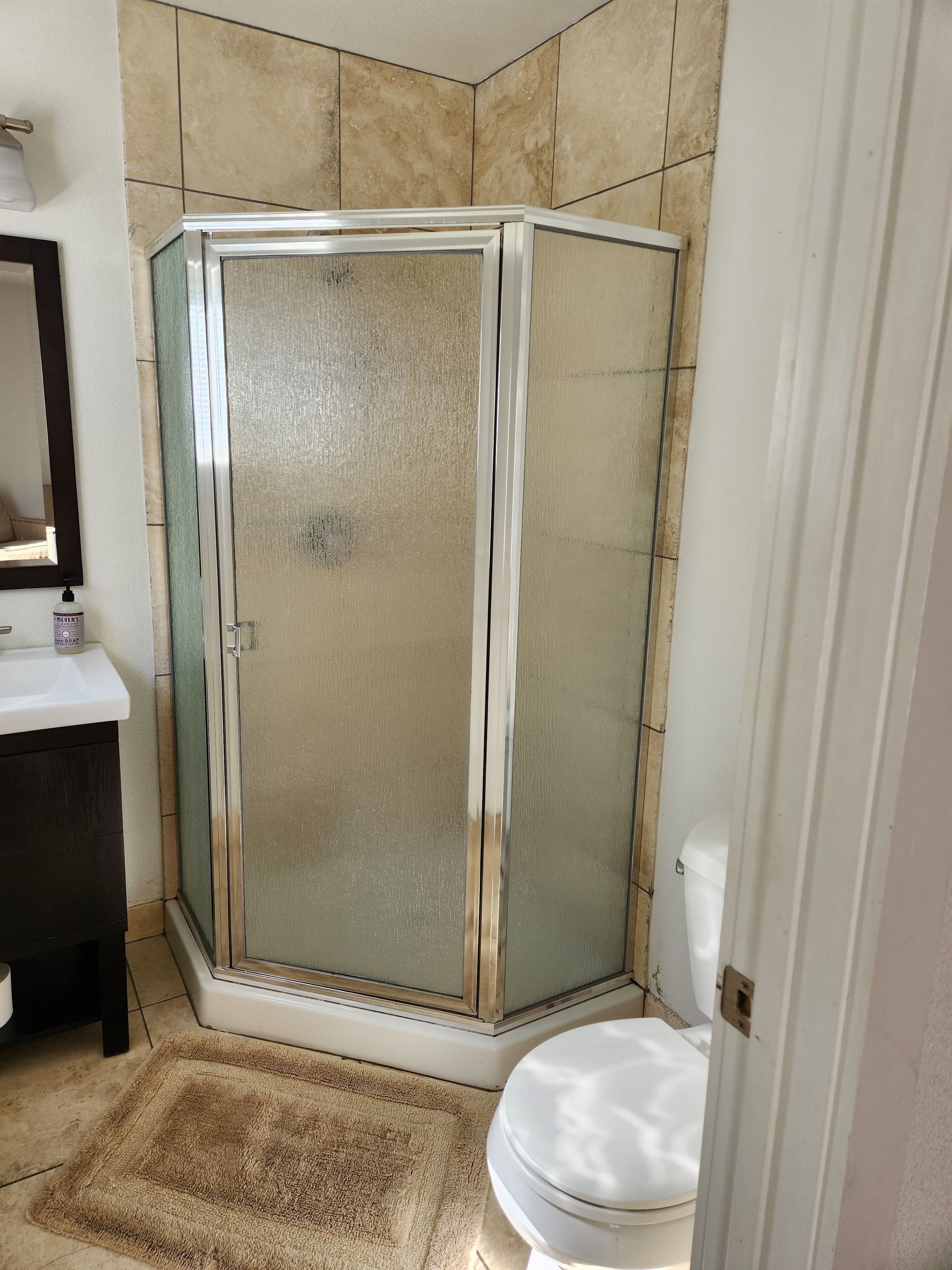 Shower, towels, soap, toilet paper