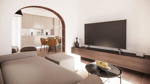 Een moderne woonkamer met een flatscreen televisie, een eethoek met stoelen, en een keuken die door een boog zichtbaar is.